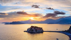 Pink sunset and Sveti Stefan sea islet 