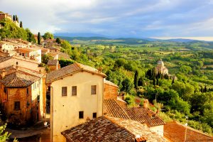 View over the Tuscan countryside and the town of Montepulciano at sunset