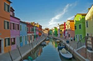 Canals lined in colourful houses in Burano, Venice