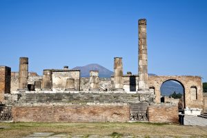 Ruins of Pompeii with Mount Vesuvius in the background.