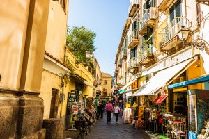 Walking on the narrow streets of Sorrento, Italy. Local shops in Sorrento.