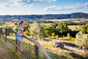 Happy,Little,Girl,Enjoying,Beautiful,Valley,And,Mountains,View,Of