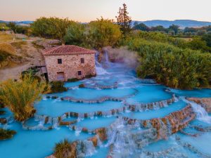 natural spa with waterfalls and hot springs at Saturnia thermal baths, Grosseto, Tuscany, Italy,Hot springs Cascate del Mulino with old watermill, Saturnia, Grosseto, Tuscany, Italy. High quality