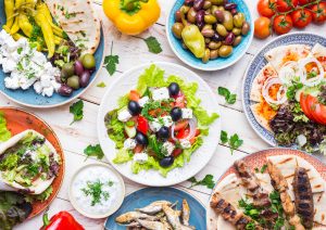 Delicious Greek foods include Meze, gyros, souvlaki, fish, pita, greek salad, tzatziki, feta, olives and more