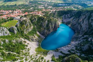 Beautiful Blue Lake in Imotski Dalmatia Croatia on warm summer day